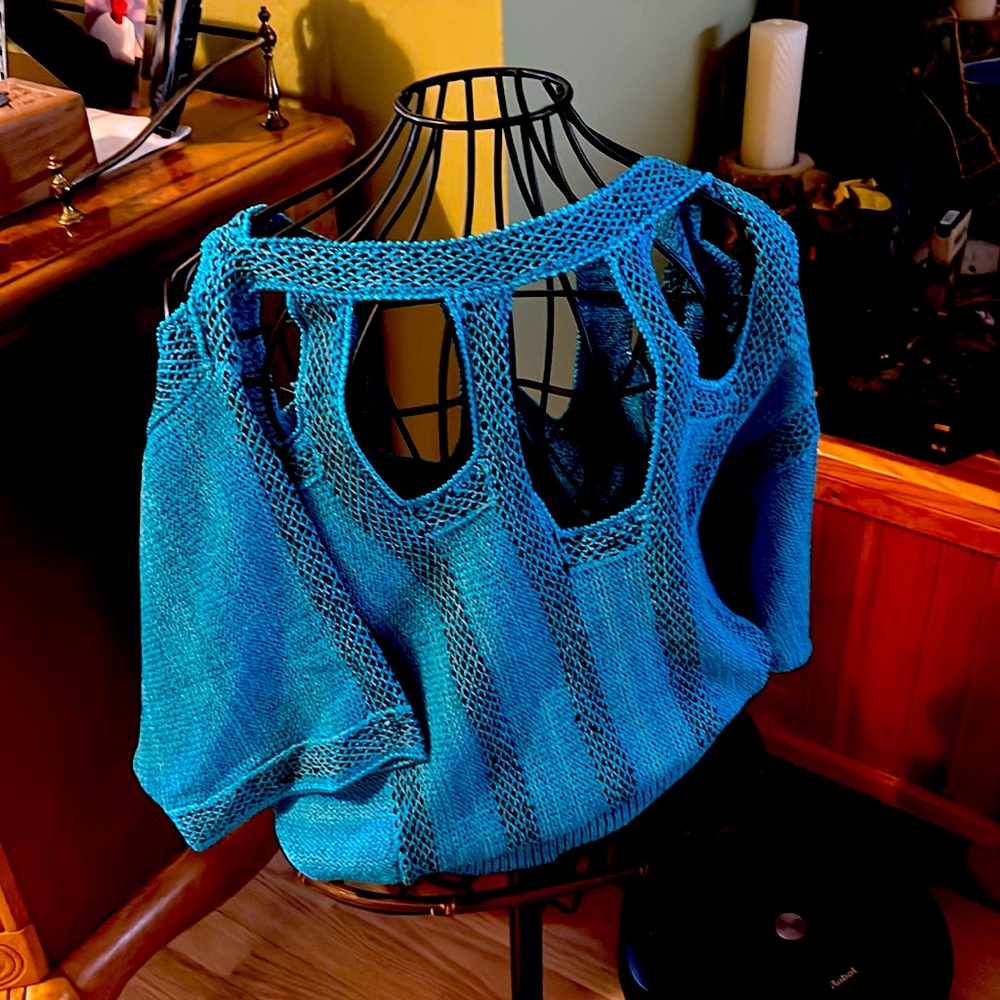 Beautiful teal with black sweater cold shoulder beautifully made.